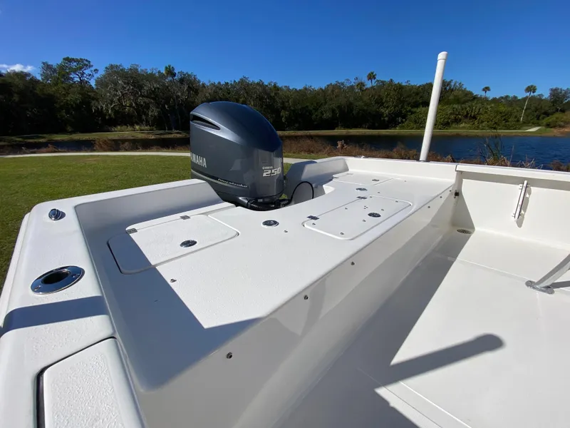 Slide: The Image of 2018 Tidewater 2400 Bay Max boat with Yamaha engine, near a scenic lake. - 23