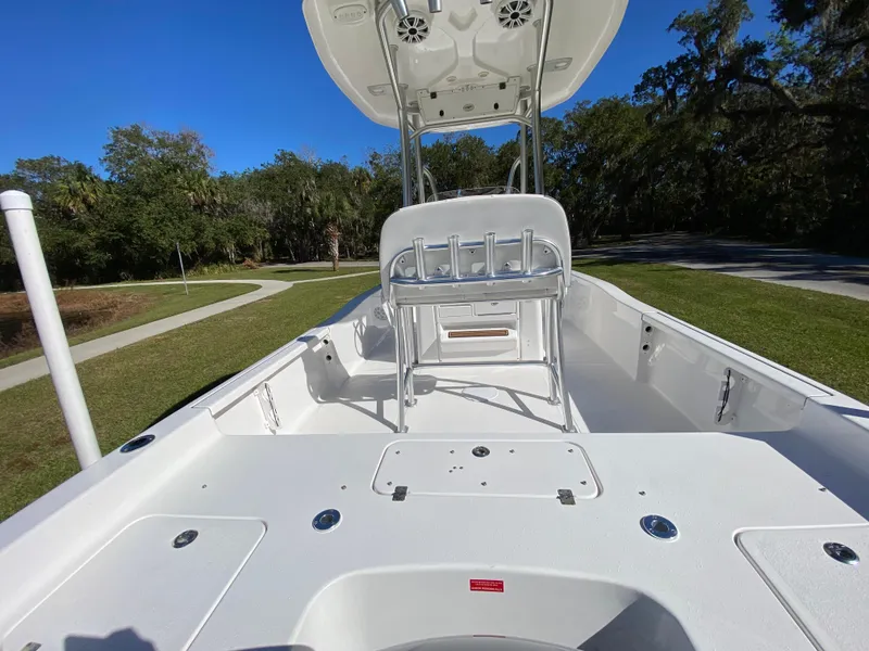 Slide: The Image of 2018 Tidewater 2400 Bay Max boat interior with seating and rod holders. - 27
