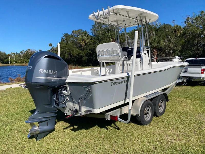 Slide: The Image of 2018 Tidewater 2400 Bay Max boat with Yamaha engine on trailer, parked on grass. - 3
