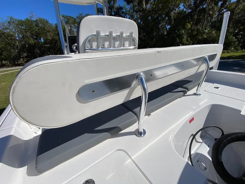 Slide: The Image of 2018 Tidewater 2400 Bay Max boat interior with rod holders and seating. - 34