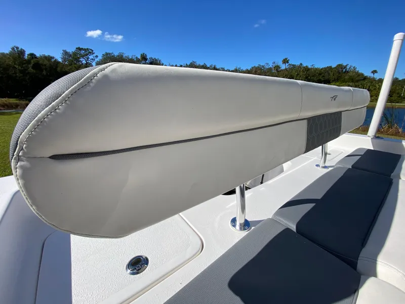 Slide: The Image of 2018 Tidewater 2400 Bay Max boat seating, featuring sleek white upholstery and modern design. - 35