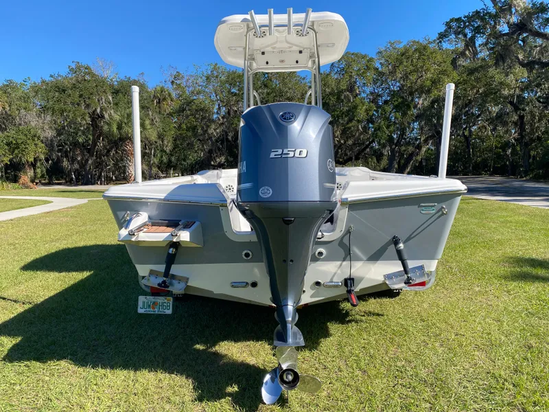 Slide: The Image of 2018 Tidewater 2400 Bay Max boat with 250 HP engine, parked on grass. - 4