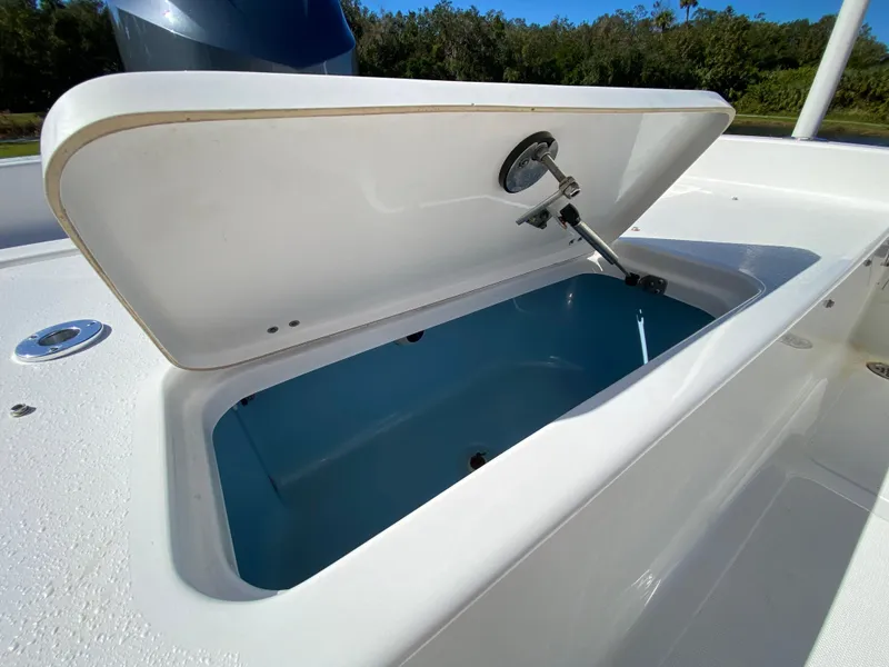 Slide: The Image of Open storage compartment on 2018 Tidewater 2400 Bay Max boat, showcasing interior space. - 42