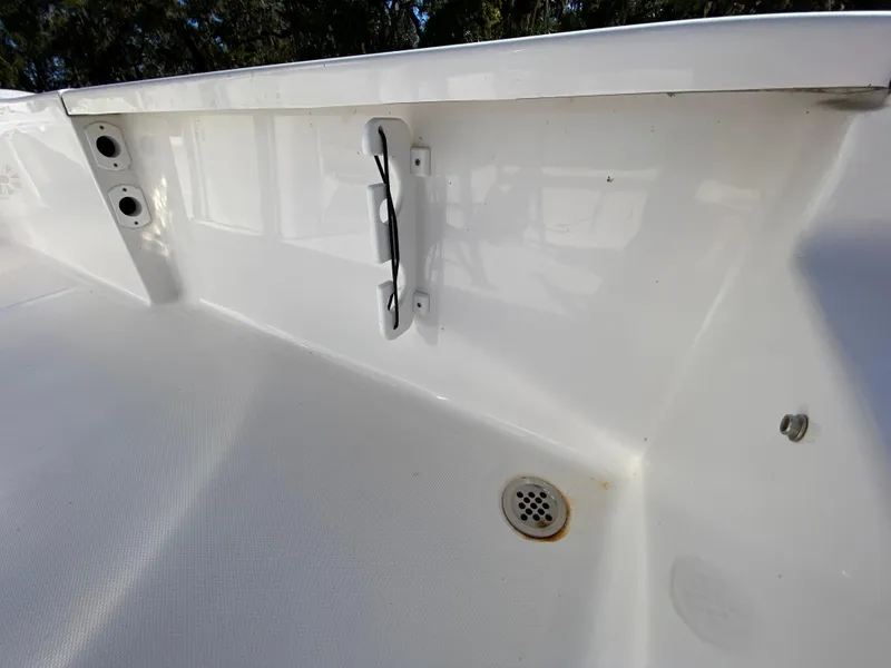 Slide: The Image of 2018 Tidewater 2400 Bay Max boat interior with drainage and wiring details. - 47