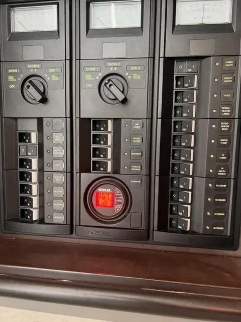 Slide: The Image of Control panel of a 2017 Cobalt A40 boat with switches and gauges. - 13