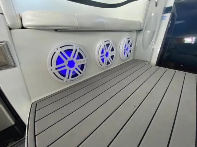 Slide: The Image of 2017 Cobalt A40 boat interior with blue-lit speakers and sleek flooring. - 14