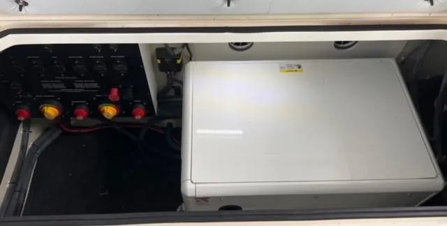 Slide: The Image of 2017 Cobalt A40 engine compartment with control panel and storage box. - 17