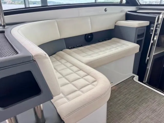 Slide: The Image of Luxurious seating area in a 2017 Cobalt A40 boat interior. - 2