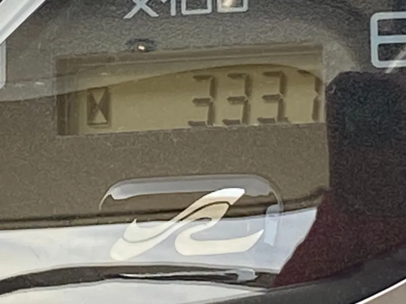 Slide: The Image of Close-up of Sea Ray 380 Sundancer 2000 boat gauge displaying 3331 hours. - 15