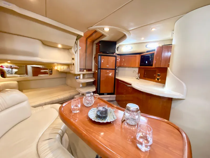 Slide: The Image of Luxurious interior of 2000 Sea Ray 380 Sundancer yacht with elegant wood finishes. - 27