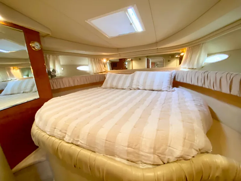 Slide: The Image of Luxurious cabin interior of 2000 Sea Ray 380 Sundancer yacht with cozy bed. - 31