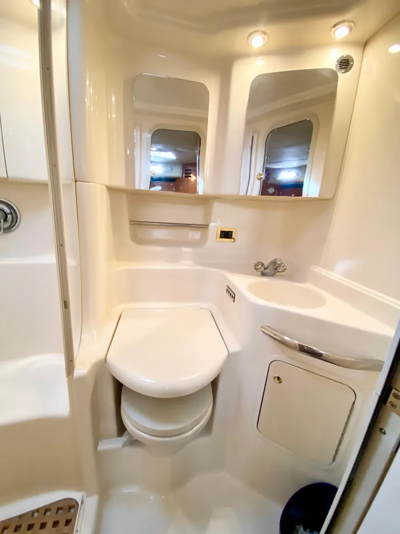 Slide: The Image of 2000 Sea Ray 380 Sundancer bathroom with mirrors and modern fixtures. - 36