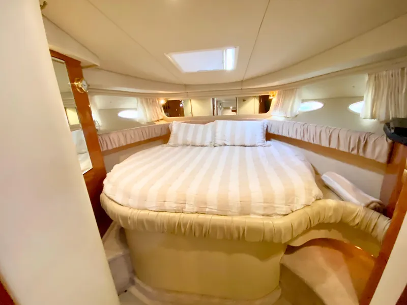 Slide: The Image of Luxurious bedroom interior of 2000 Sea Ray 380 Sundancer yacht with cozy bed. - 37