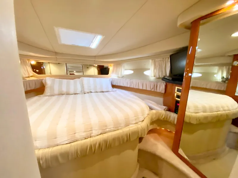 Slide: The Image of Luxurious cabin interior of 2000 Sea Ray 380 Sundancer yacht with cozy bed. - 38