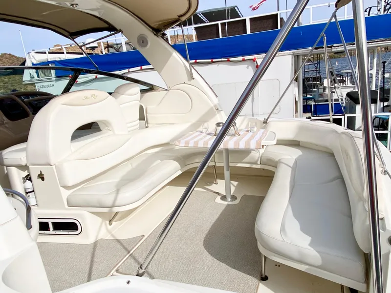 Slide: The Image of 2000 Sea Ray 380 Sundancer yacht with spacious white seating area. - 7