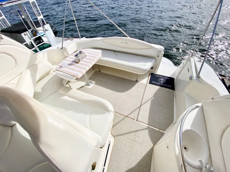 Slide: The Image of Luxurious 2000 Sea Ray 380 Sundancer yacht interior with elegant seating and ocean view. - 8