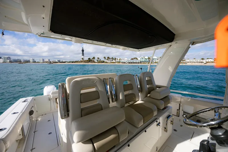 Slide: The Image of 2017 Boston Whaler 420 Outrage interior with plush seating, ocean view, and modern design. - 4