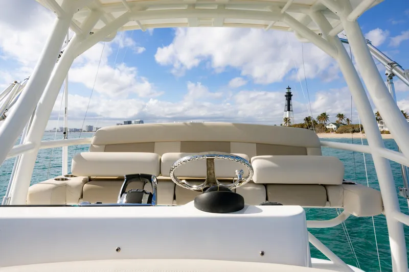 Slide: The Image of Boston Whaler 420 Outrage 2017 boat helm with ocean and lighthouse view. - 5