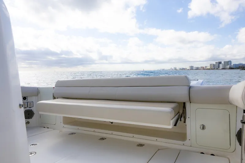 Slide: The Image of 2017 Boston Whaler 420 Outrage boat interior with ocean view and seating. - 7