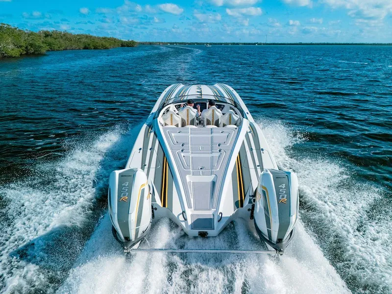 Slide: The Image of MTI 390X 2022 speedboat cruising on open water, rear view. - 3