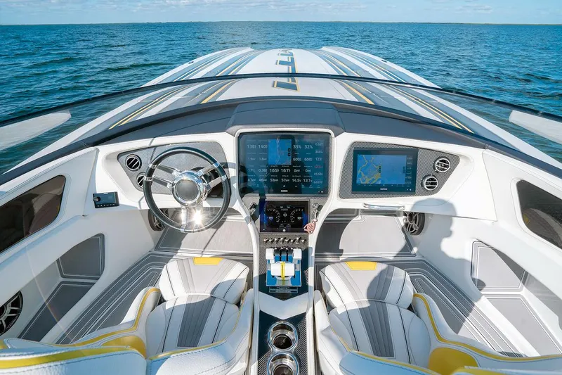 Slide: The Image of Luxury MTI 390X 2022 boat cockpit with advanced navigation system on open water. - 6