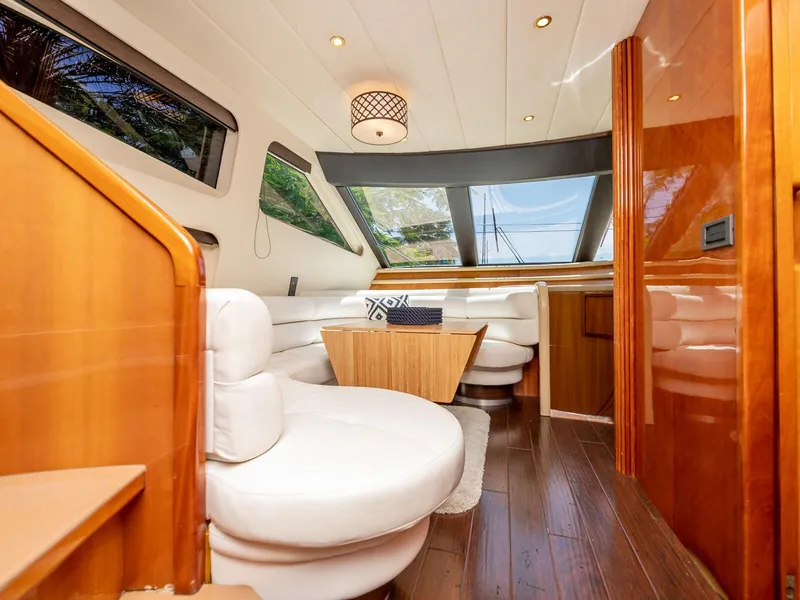 Slide: The Image of Luxurious interior of 2000 Azimut 70 Sea-Jet yacht with elegant seating and wood finishes. - 11