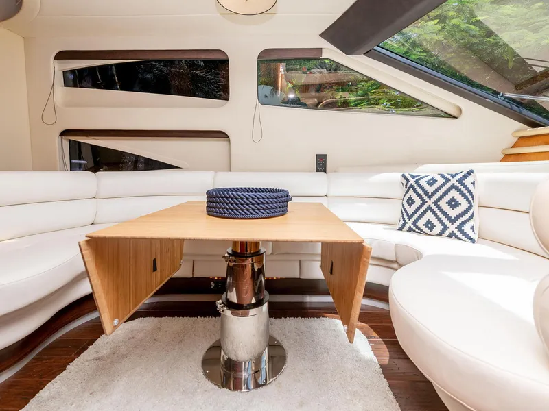 Slide: The Image of Luxurious interior of 2000 Azimut 70 Sea-Jet yacht with elegant seating and table. - 12