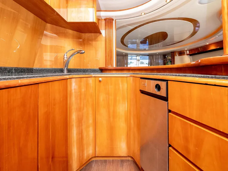 Slide: The Image of Luxurious kitchen interior of 2000 Azimut 70 Sea-Jet yacht with wood cabinetry and modern fixtures. - 19
