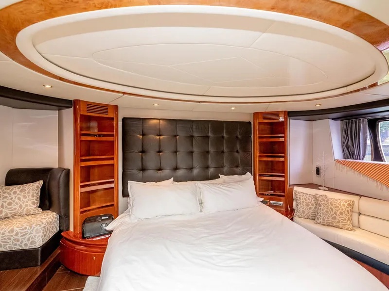 Slide: The Image of Luxurious bedroom interior of 2000 Azimut 70 Sea-Jet yacht with elegant wood accents. - 36