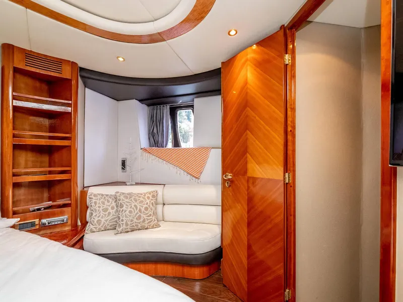 Slide: The Image of Luxurious interior of 2000 Azimut 70 Sea-Jet yacht with elegant wood finishes and cozy seating. - 38