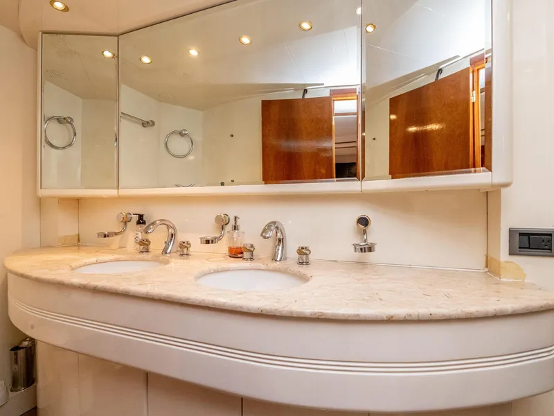 Slide: The Image of Luxurious bathroom vanity on 2000 Azimut 70 Sea-Jet yacht with dual sinks and mirrors. - 40