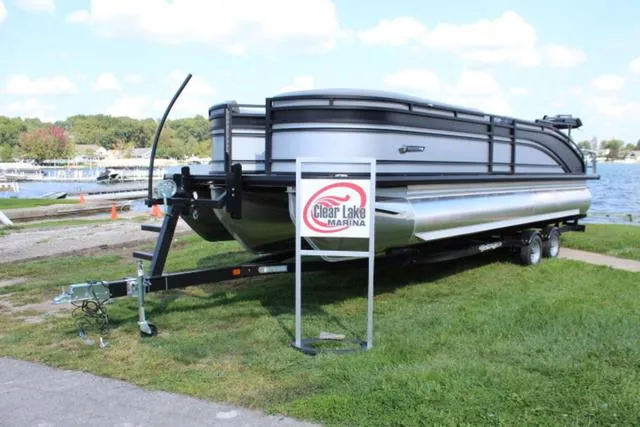 Slide: The Image of 2024 Harris Solstice 250 SL pontoon boat on trailer at Clear Lake Marina. - 2