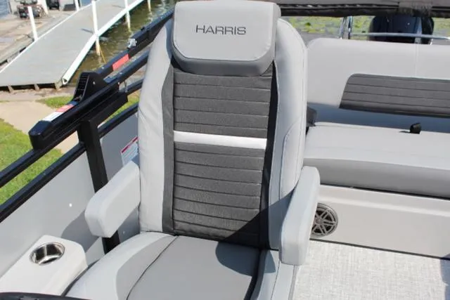 Slide: The Image of 2024 Harris Solstice 250 SL boat seat with gray and black upholstery. - 20