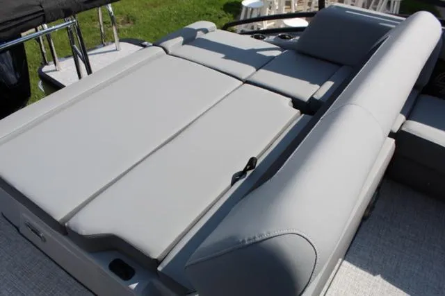 Slide: The Image of 2024 Harris Solstice 250 SL boat with spacious gray seating and sun lounge. - 27