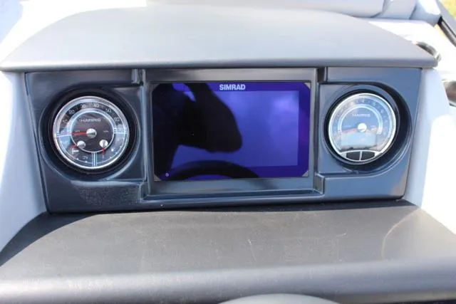 Slide: The Image of 2024 Harris Solstice 250 SL dashboard with Simrad display and gauges. - 29