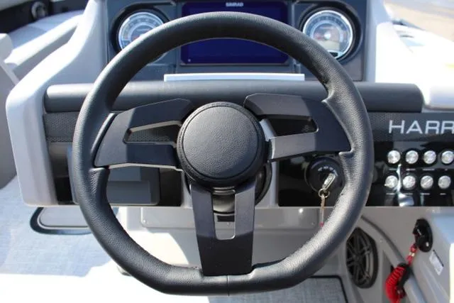 Slide: The Image of 2024 Harris Solstice 250 SL steering wheel and dashboard controls. - 31
