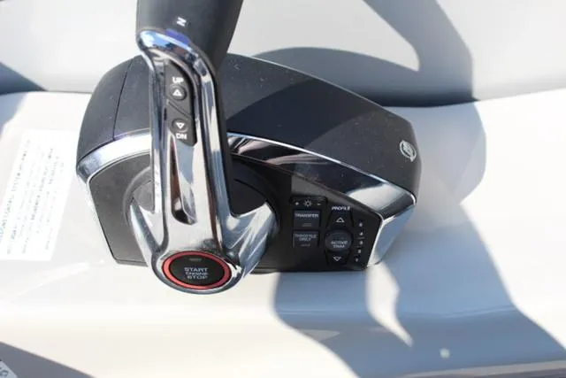 Slide: The Image of 2024 Harris Solstice 250 SL throttle control with start/stop button. - 33