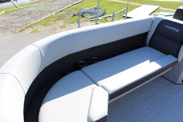 Slide: The Image of 2024 Harris Cruiser 230 CS boat interior with gray seating and cup holders. - 11