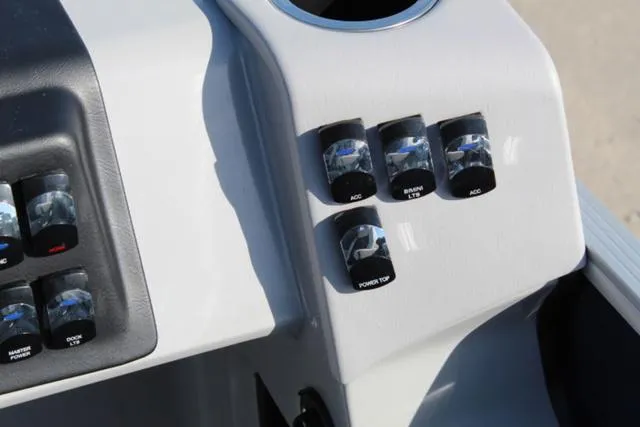 Slide: The Image of Control panel of 2024 Harris Cruiser 230 CS boat with labeled switches. - 15