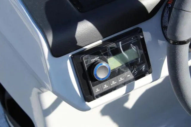 Slide: The Image of 2024 Harris Cruiser 230 CS dashboard with Clarion audio system. - 17
