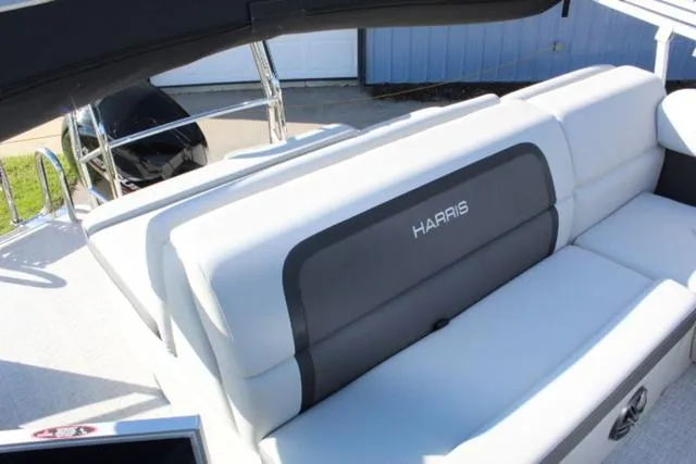 Slide: The Image of 2024 Harris Cruiser 230 CS boat with sleek white seating and modern design. - 18