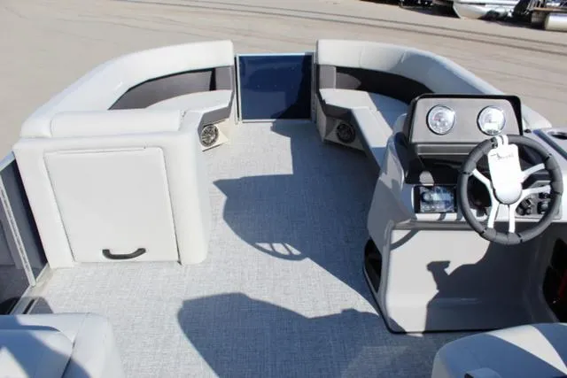 Slide: The Image of 2024 Harris Cruiser 230 CS pontoon boat interior with plush seating and modern dashboard. - 20