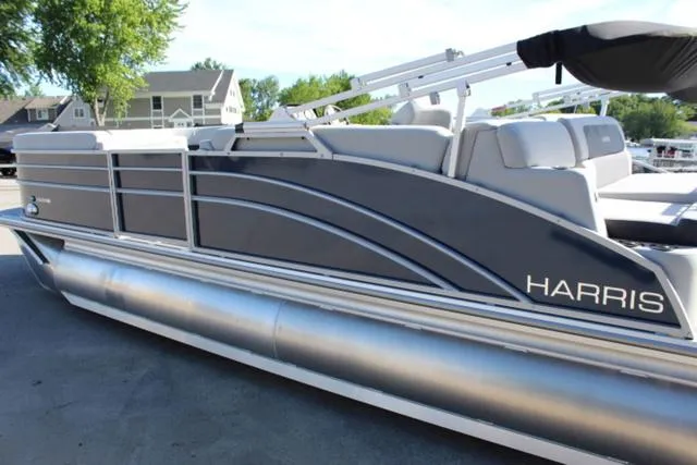 Slide: The Image of 2024 Harris Cruiser 230 CS pontoon boat with sleek design and modern features. - 7