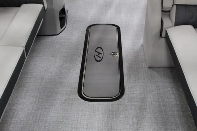 Slide: The Image of 2024 Harris Sunliner 250 SLDH interior with sleek flooring and storage compartment. - 10