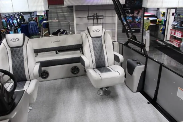 Slide: The Image of 2024 Harris Sunliner 250 SLDH boat interior with luxury seating and modern design. - 11