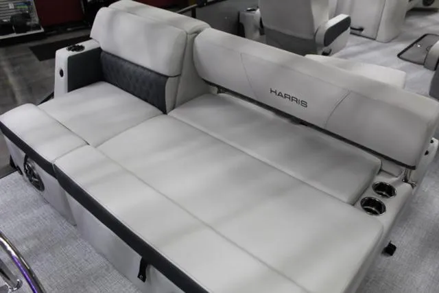 Slide: The Image of 2024 Harris Sunliner 250 SLDH boat interior with luxurious seating and cup holders. - 13