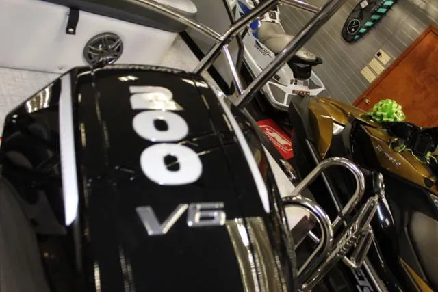 Slide: The Image of Close-up of a 2024 Harris Sunliner 250 SLDH boat engine, showcasing "300 V6" branding. - 20