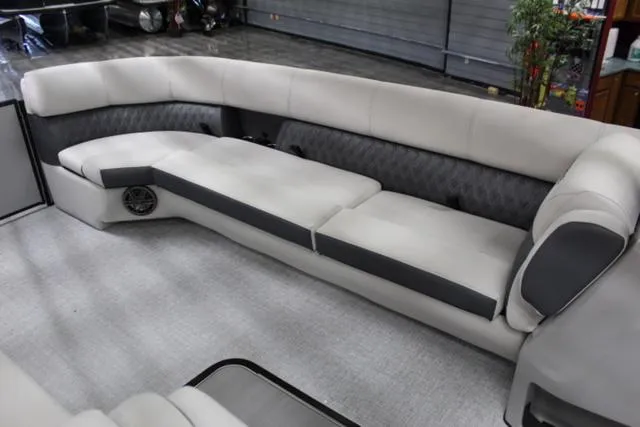 Slide: The Image of 2024 Harris Sunliner 250 SLDH boat interior with plush seating and modern design. - 21