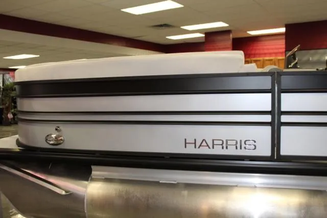 Slide: The Image of 2024 Harris Sunliner 250 SLDH pontoon boat in showroom display. - 4