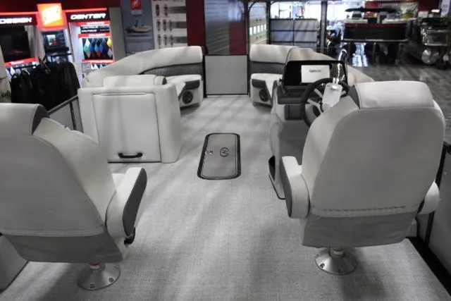 Slide: The Image of 2024 Harris Sunliner 250 SLDH pontoon boat interior with plush seating and modern design. - 5